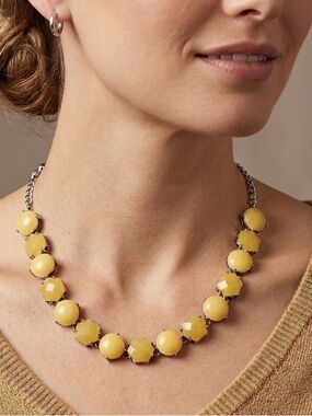 A beautiful vintage cream/ soft yellow and silver tone statement necklace.